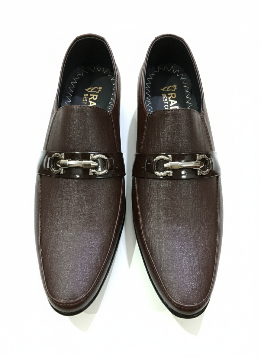 Pair of brown loafers with metallic buckles on a white background