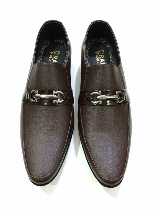 Pair of brown loafers with metallic buckles on a white background