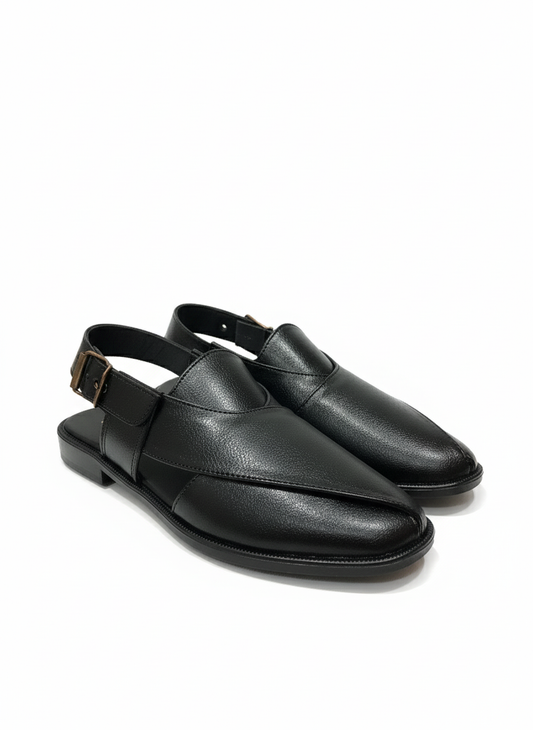 Pair of black Gucci shoes on a white background